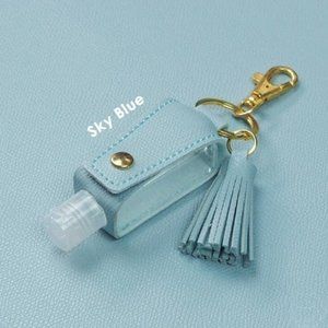 2 Keychains w/ hand sanitizer empty plastic bottle